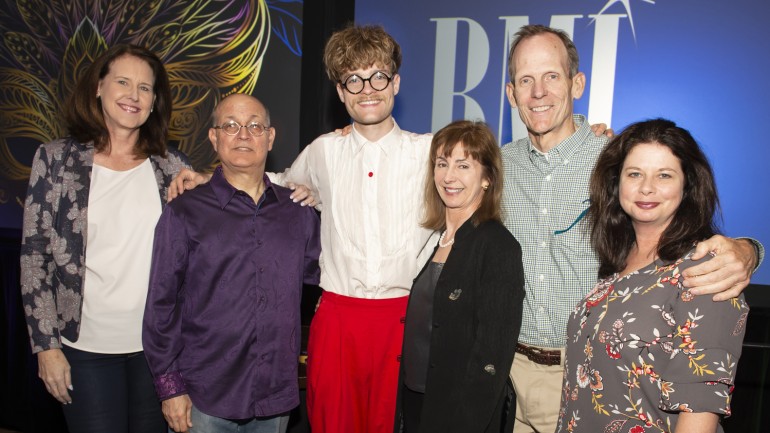 Pictured (L-R) before Jake Wesley Rogers’ performance at the MFM Awards Reception at the Hilton Riverside Hotel in New Orleans are: WarnerMedia SVP/ Deputy Controller and MFM Board Chair Cindy Pekrul, Manship Media CFO and Media Finance Focus Conference Chair Ralph Bender, BMI songwriter Jake Wesley Rogers, MFM President and CEO Mary Collins, and BMI’s Jessica Frost and Dan Spears.