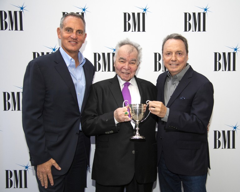 BMI's Mike O'Neill, Troubadour Award recipient John Prine and BMI's VP, Creative, Nashville Jody Williams gather for a photo at BMI’s Nashville office on September 10, 2018