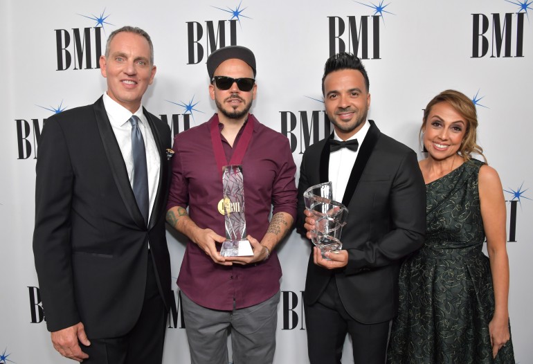 (L-R) BMI President and Chief Executive Officer Michael O'Neill, honoree Residente, honoree Luis Fonsi, and BMI Vice President of Latin Music Delia Orjuela attend the 25th Annual BMI Latin Awards at Regent Beverly Wilshire Hotel on March 20, 2018 in Beverly Hills, California