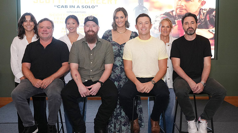Back Row L-R: BMI’s Claire Dodelin, BMI’s Lilly Brown, BMI’s MaryAnn Keen, BMI’s Leslie Roberts; Front Row L-R: Frank Rogers (ASCAP), Brent Anderson (ASCAP), Scotty McCreery (BMI), Derek Wells (Producer).