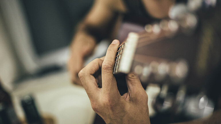 person playing guitar